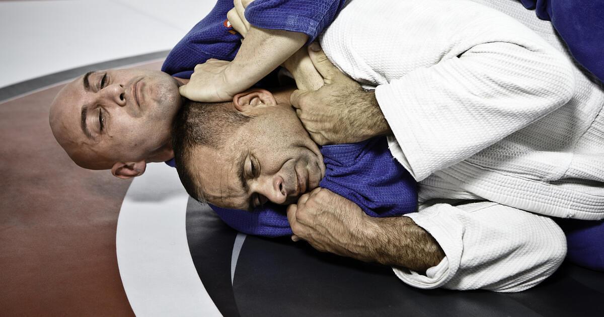 A rear naked choke is being applied, which is a "blood" strangle and not an "air" choke.